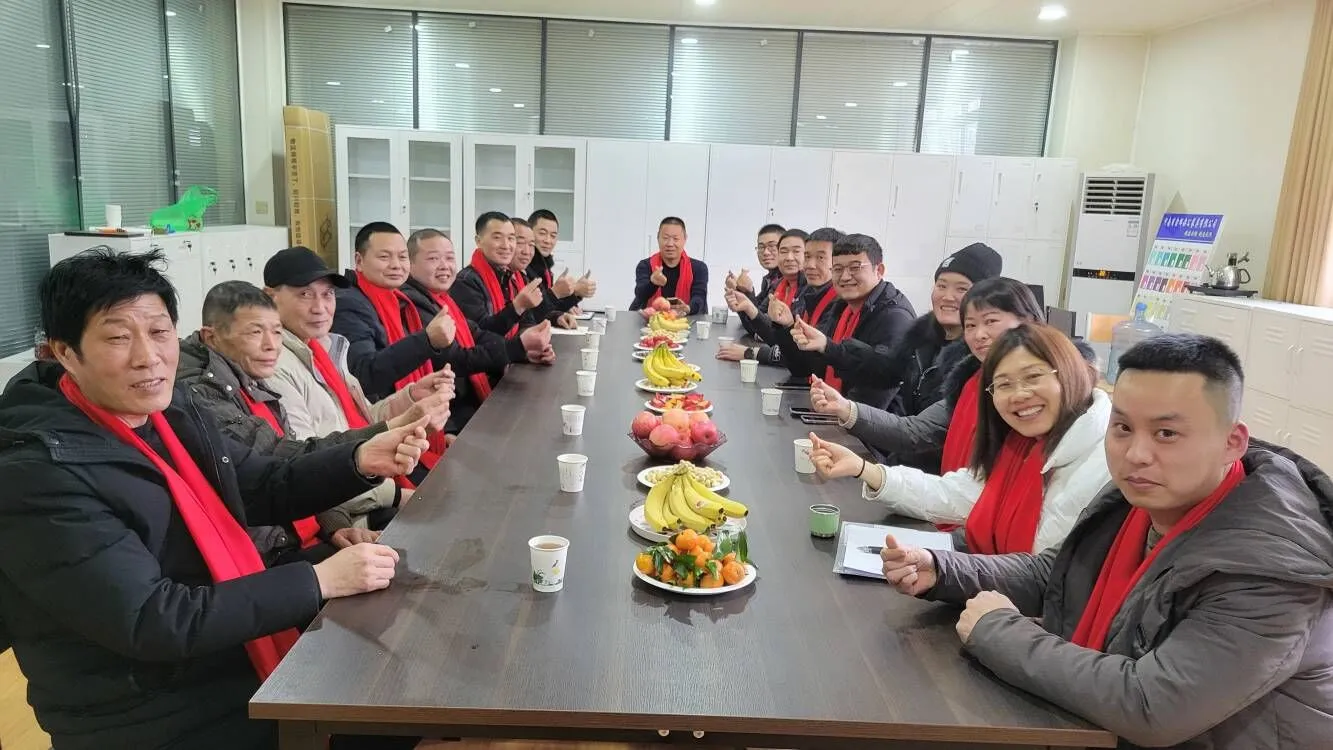 In 2021 spring festival , major leaders had a meeting in the factory . they are smile and happy .